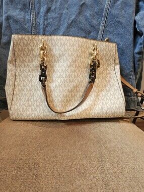 Michael Kors Beige MK Monogram Tote with Gold Chain/ leopard. Handles